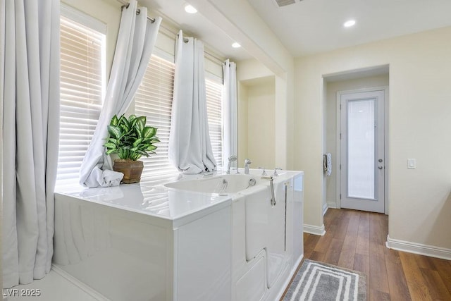 580 Via Di Parione Ct, Henderson, NV 89011 - clothes washing area featuring visible vents, dark wood-style flooring, baseboards, and recessed lighting