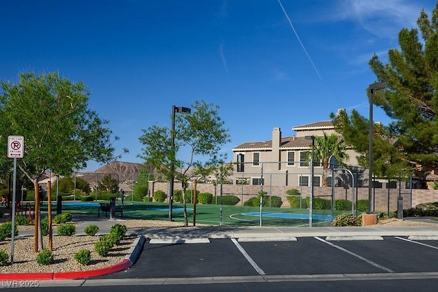 580 Via Di Parione Ct, Henderson, NV 89011 - view of property's community featuring uncovered parking, fence, and community basketball court