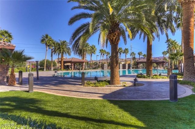 580 Via Di Parione Ct, Henderson, NV 89011 - view of home's community with a gazebo, a lawn, and a swimming pool