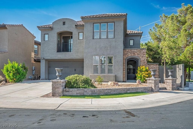 580 Via Di Parione Ct, Henderson, NV 89011 - mediterranean / spanish home with driveway, stucco siding, a tile roof, and a garage