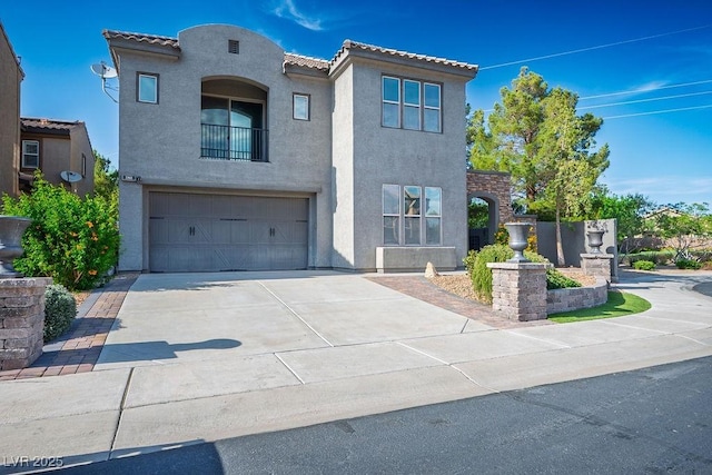 580 Via Di Parione Ct, Henderson, NV 89011 - mediterranean / spanish home featuring a tiled roof, stucco siding, driveway, and a garage
