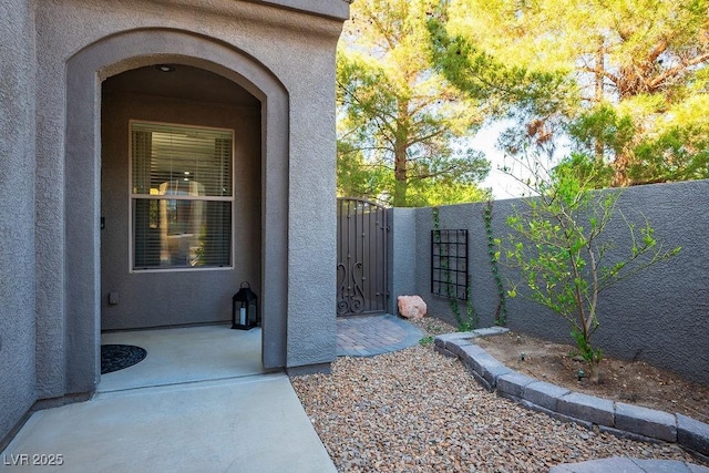 580 Via Di Parione Ct, Henderson, NV 89011 - entrance to property with a gate, fence, and stucco siding