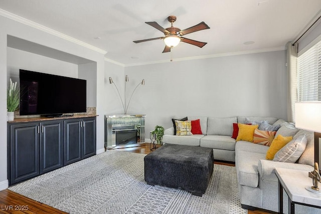 580 Via Di Parione Ct, Henderson, NV 89011 - living area featuring crown molding, baseboards, a ceiling fan, and wood finished floors