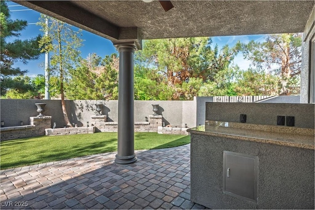 580 Via Di Parione Ct, Henderson, NV 89011 - view of patio / terrace featuring a fenced backyard and a ceiling fan