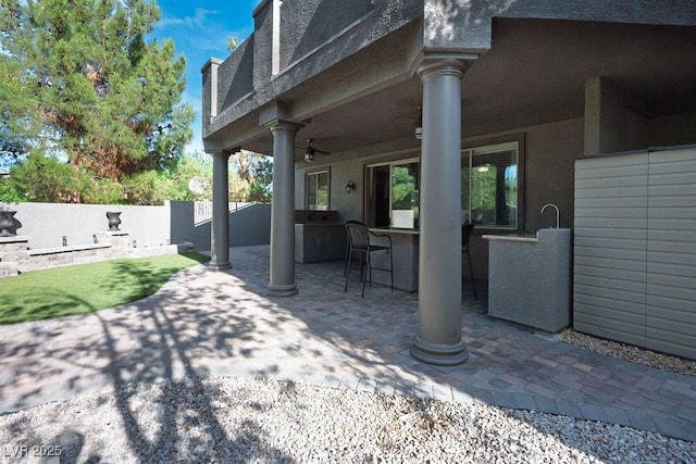 580 Via Di Parione Ct, Henderson, NV 89011 - view of patio / terrace featuring a ceiling fan, an outdoor bar, and fence