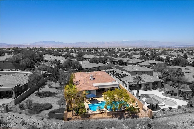 aerial view featuring a mountain view and a residential view