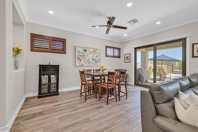 dining area featuring visible vents, ceiling fan, light wood-style floors, baseboards, and recessed lighting