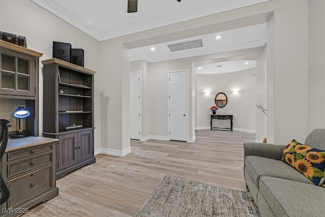 living room featuring baseboards, light wood-type flooring, ceiling fan, and recessed lighting