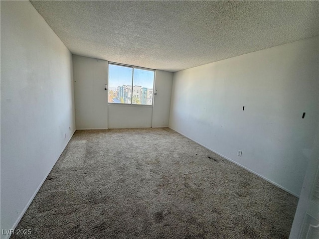 3930 University Center Dr Unit 409, Las Vegas, NV 89119 - carpeted empty room with a textured ceiling