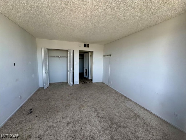 3930 University Center Dr Unit 409, Las Vegas, NV 89119 - unfurnished bedroom with carpet flooring and a textured ceiling