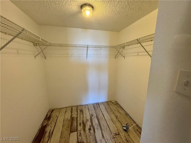 3930 University Center Dr Unit 409, Las Vegas, NV 89119 - spacious closet with wood finished floors