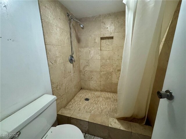 3930 University Center Dr Unit 409, Las Vegas, NV 89119 - full bathroom featuring toilet and a tile shower