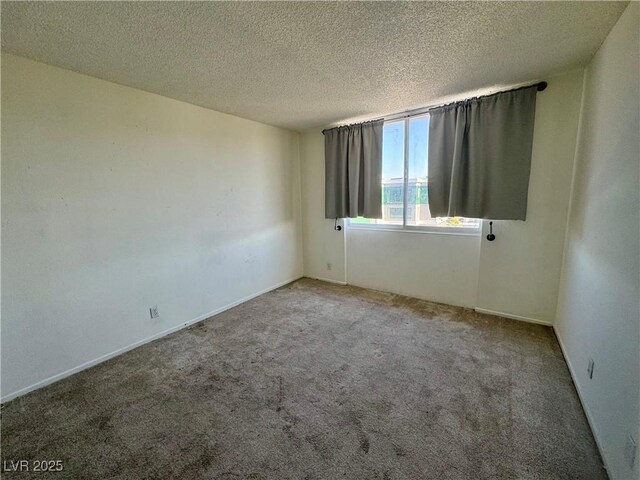 3930 University Center Dr Unit 409, Las Vegas, NV 89119 - unfurnished room featuring carpet and a textured ceiling