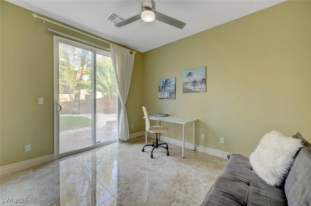 office space featuring visible vents, ceiling fan, and baseboards