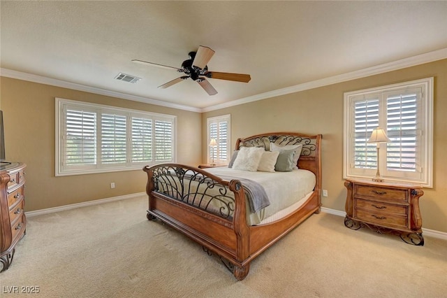 bedroom featuring baseboards, crown molding, visible vents, ceiling fan, and light colored carpet