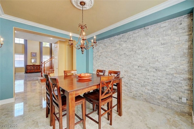 dining space featuring crown molding, marble finish floor, a notable chandelier, and stairway