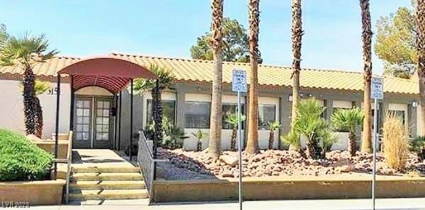 3151 Soaring Gulls Dr Unit 2035, Las Vegas, NV 89128 - view of front of house with stucco siding and french doors