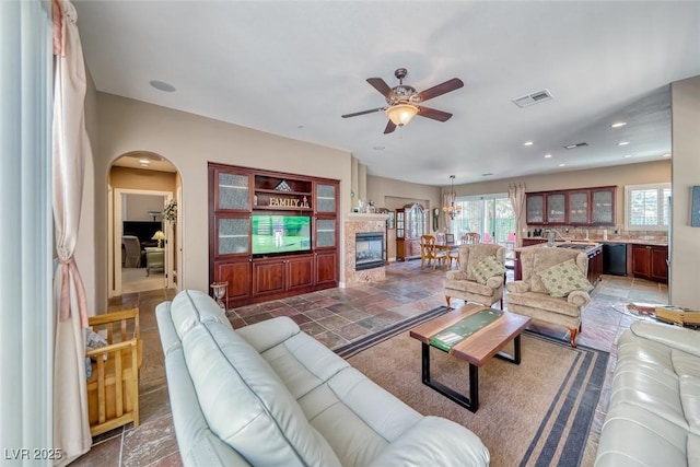 1045 Via Camelia St, Henderson, NV 89011 - living area with recessed lighting, arched walkways, visible vents, and ceiling fan
