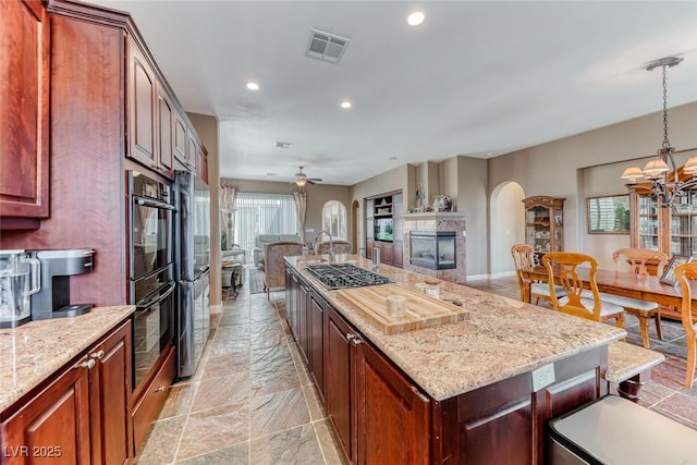 1045 Via Camelia St, Henderson, NV 89011 - kitchen featuring visible vents, open floor plan, recessed lighting, and a wealth of natural light