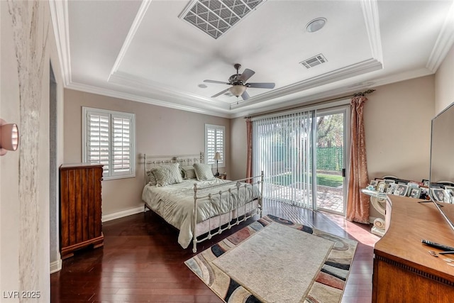 1045 Via Camelia St, Henderson, NV 89011 - bedroom featuring access to exterior, visible vents, a tray ceiling, and hardwood / wood-style floors