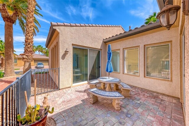 1045 Via Camelia St, Henderson, NV 89011 - view of patio featuring a balcony