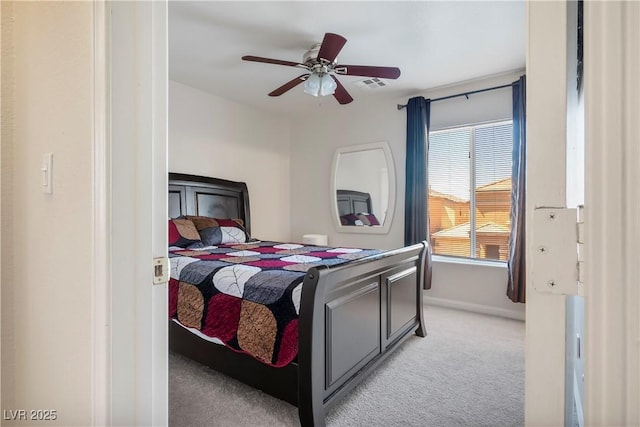 bedroom with visible vents, baseboards, ceiling fan, and light carpet
