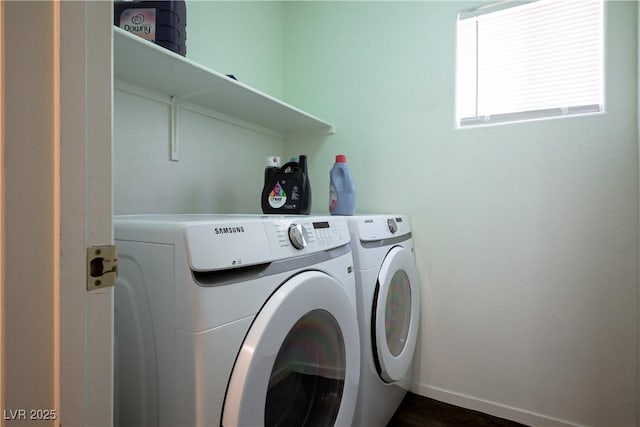 laundry area featuring laundry area, separate washer and dryer, and baseboards