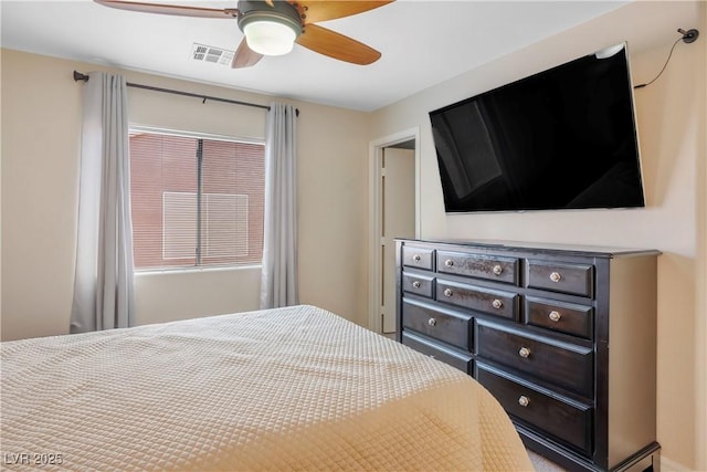 bedroom with visible vents, multiple windows, and a ceiling fan