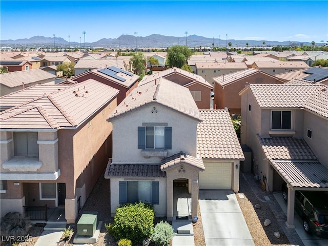 aerial view featuring a mountain view and a residential view