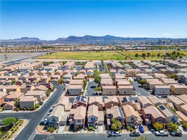 birds eye view of property featuring a mountain view and a residential view