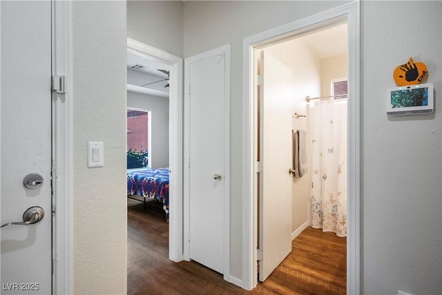 hallway with dark wood-style floors