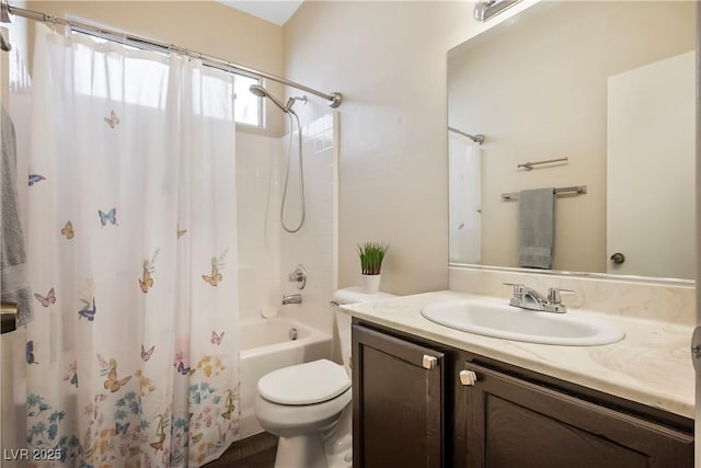 full bathroom featuring shower / bath combo with shower curtain, vanity, and toilet