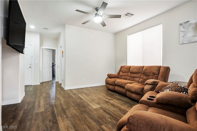 living room featuring wood finished floors, baseboards, a ceiling fan, and visible vents
