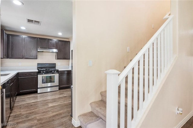 kitchen featuring visible vents, recessed lighting, appliances with stainless steel finishes, under cabinet range hood, and light wood finished floors