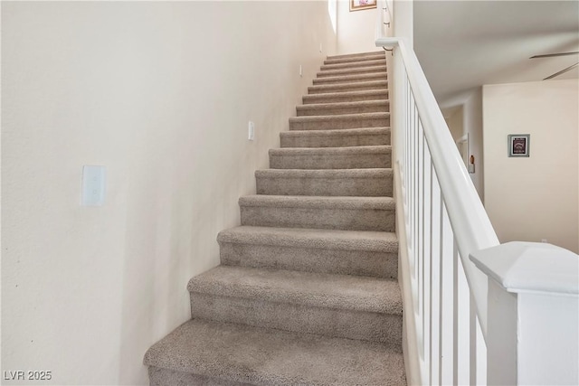 staircase with ceiling fan