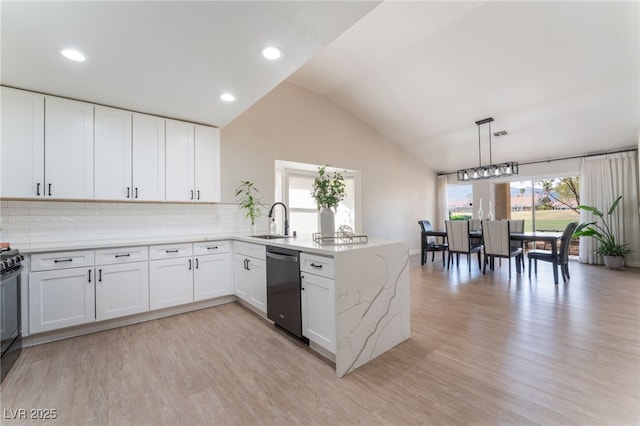 2725 Showcase Dr, Las Vegas, NV 89134 - kitchen featuring a peninsula, light wood-style floors, lofted ceiling, dishwasher, and a sink