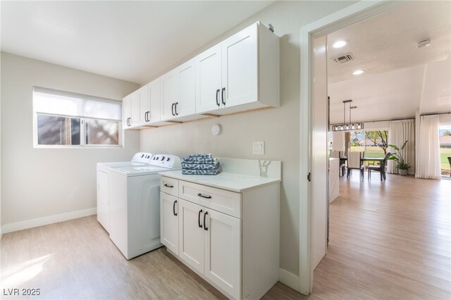 2725 Showcase Dr, Las Vegas, NV 89134 - clothes washing area featuring visible vents, light wood finished floors, baseboards, and washing machine and dryer