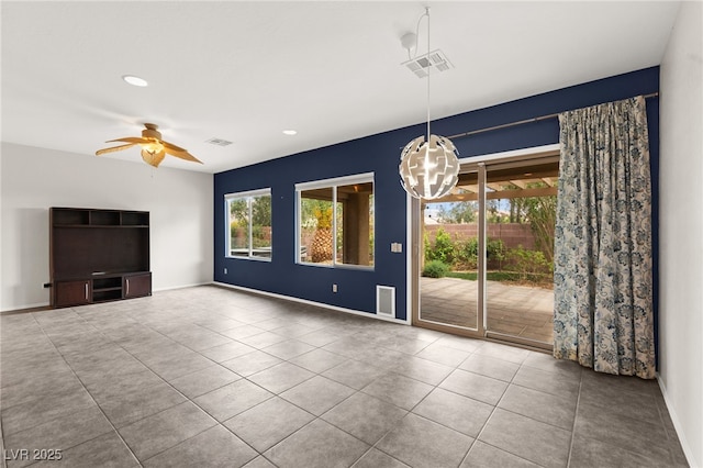 3528 Tack St, Las Vegas, NV 89122 - unfurnished living room with ceiling fan with notable chandelier, tile patterned flooring, visible vents, and recessed lighting