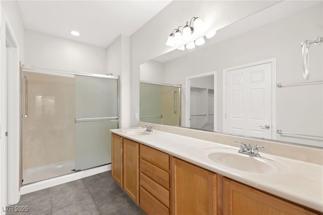 3528 Tack St, Las Vegas, NV 89122 - bathroom with a stall shower, double vanity, a sink, and tile patterned floors