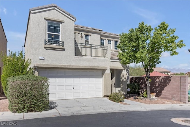 view of front of house with fence, a garage, stucco siding, and concrete driveway
