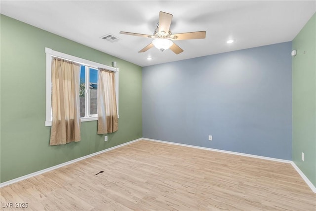 spare room featuring visible vents, baseboards, ceiling fan, recessed lighting, and wood finished floors