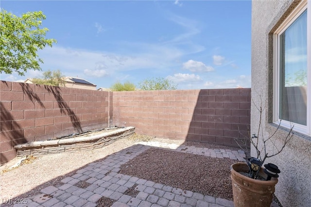 view of yard featuring a patio area and a fenced backyard