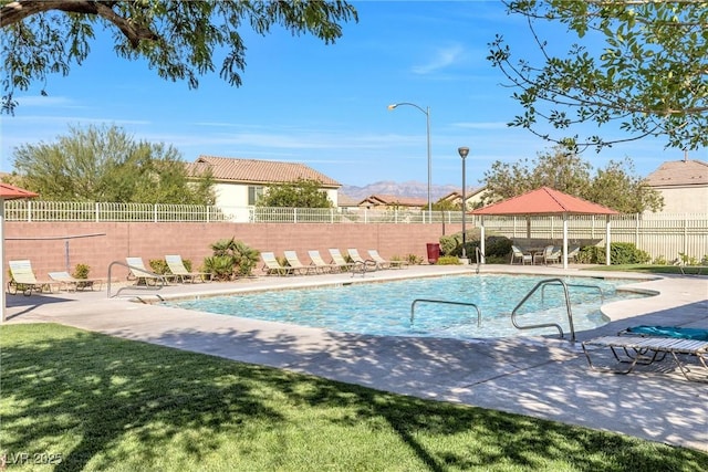 pool with a patio area, a gazebo, and a fenced backyard