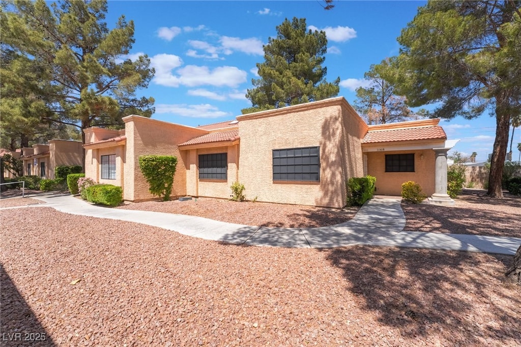 2851 S Valley View Blvd Unit 1068, Las Vegas, NV 89102 - view of front facade featuring stucco siding and a tile roof