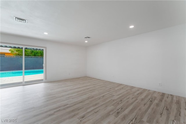 1808 E Saint Louis Ave, Las Vegas, NV 89104 - unfurnished room with wood finished floors and recessed lighting