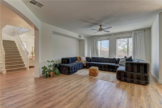 9992 Sky Parlor Rd, Las Vegas, NV 89178 - living room featuring stairs, visible vents, ceiling fan, and wood finished floors