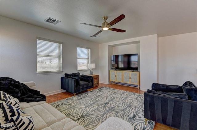 9992 Sky Parlor Rd, Las Vegas, NV 89178 - living room with visible vents, ceiling fan, wood finished floors, and baseboards