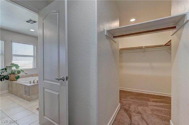 9992 Sky Parlor Rd, Las Vegas, NV 89178 - spacious closet with tile patterned flooring and visible vents