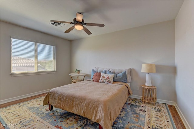 9992 Sky Parlor Rd, Las Vegas, NV 89178 - bedroom with visible vents, baseboards, ceiling fan, and wood finished floors