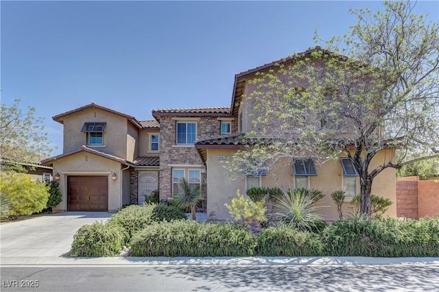 9992 Sky Parlor Rd, Las Vegas, NV 89178 - mediterranean / spanish-style house with a tiled roof, an attached garage, stone siding, concrete driveway, and stucco siding